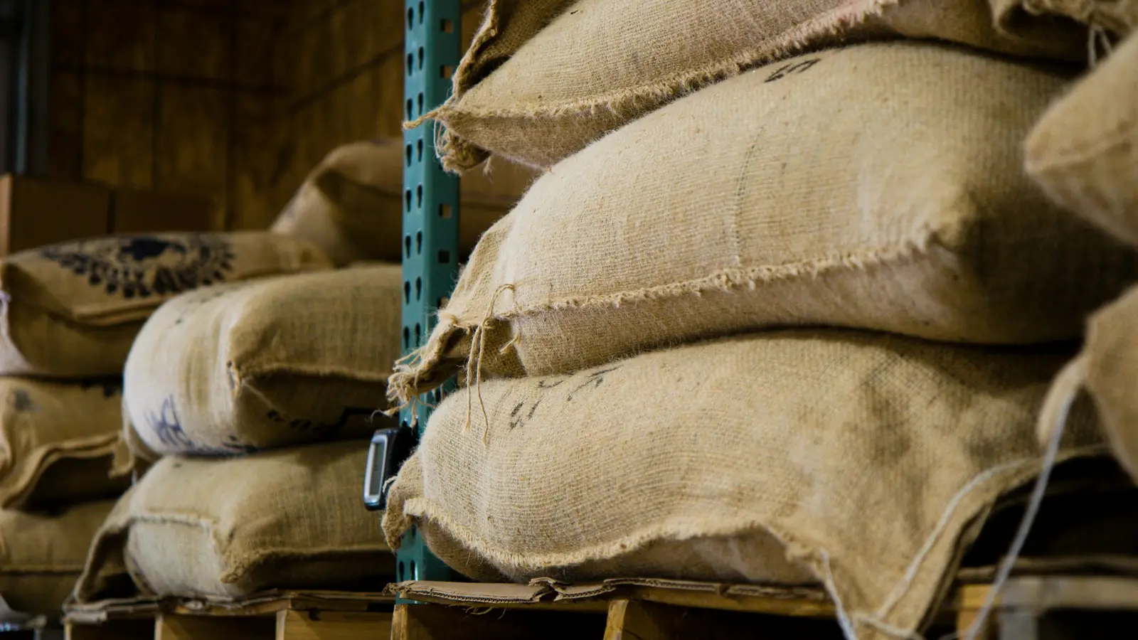 specialty coffee roastery warm interior burlap sacks beans
